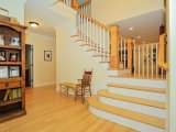 Oak newel posts and stair treads with painted ballusters, stringers and risers