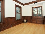 Custom paneled wainscot, trim and window seat made from cherry