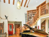 Built in library with mahogany inlays wrap around stair from basement to second level