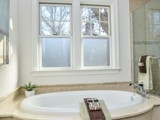 Tub skirt and tile follow elliptical tub lines